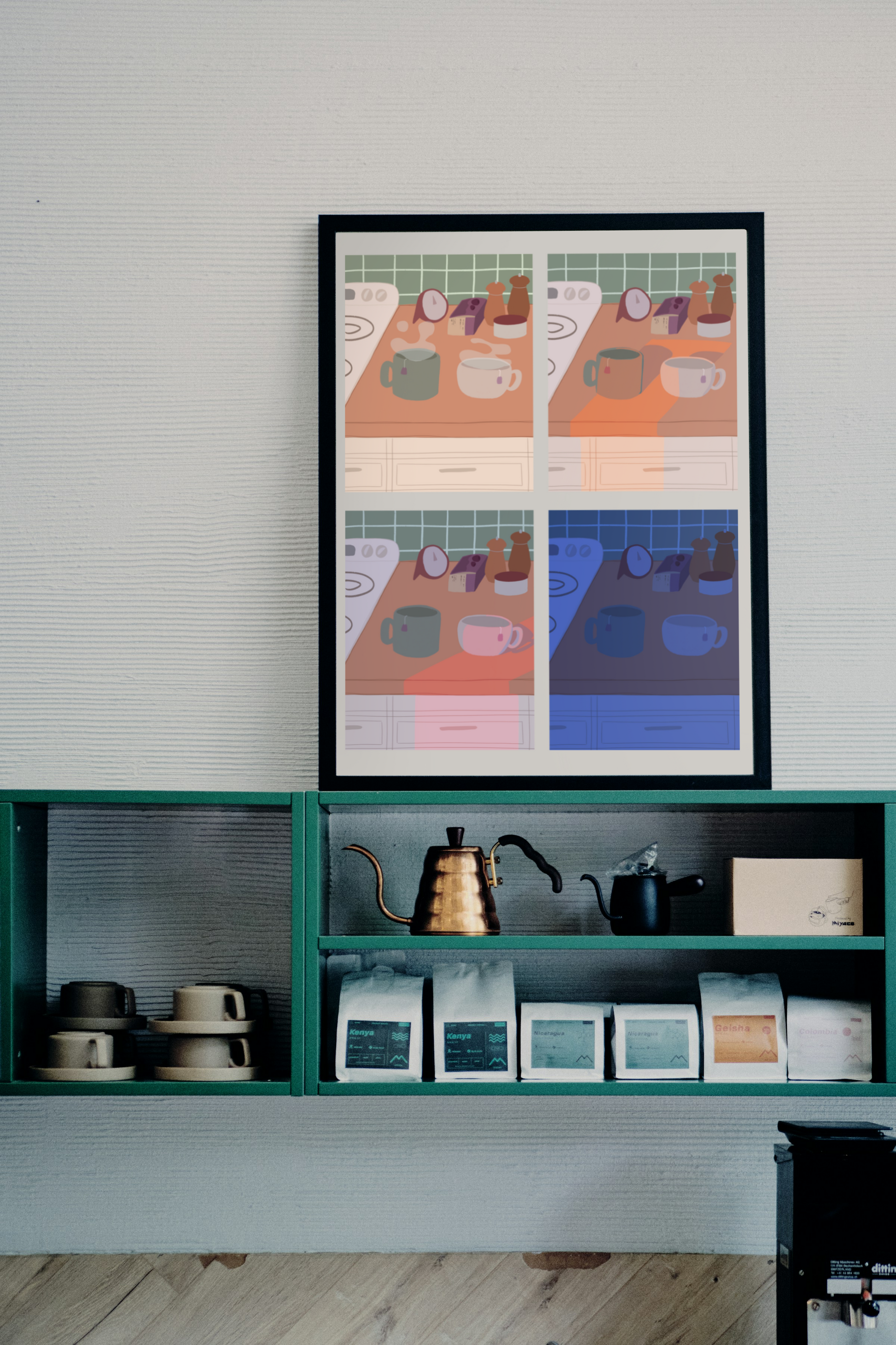 Framed poster on a wall above a green shelf with tea supplies. The poster is of four illustrations of a kitchen counter with two mugs holding tea bags in various lighting (morning, noon, evening and night). In the background are two pepper grinders, a tea box, a salt dish, and a timer. On the left is a white stovetop, white cabinet drawers at the bottom, and green tiles for the backsplash. 
